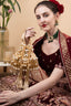 Gold handcrafted potli bag with cut dana and pearl work heart handle and chain strap for wedding and festive wear