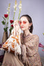 Velvet potli bag with cascading pearl strands, drawstring closure and embellished handle for wedding and festive occasions