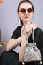 Silver potli bag with cutdana pearl and sequin embellishments on raw silk fabric with tassel for wedding and festive wear