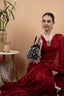 Black velvet potli bag with crystal dangling stones and bead embellishments for wedding and festive wear