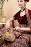 Gold handcrafted potli bag with beadwork and sequin embellishments for wedding and festive wear