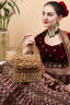 Gold handcrafted evening handbag with Cut Dana floral embroidery, pearl and bead detailing with tassels for wedding and festive wear