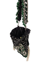 Black handcrafted potli bag with sequin cutdana beadwork stones and drawstring closure for festive and wedding wear