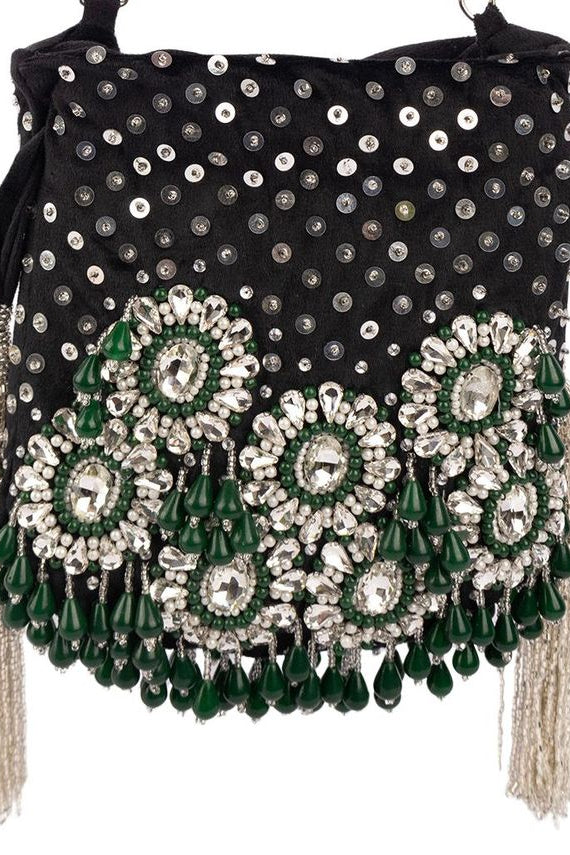 Black handcrafted potli bag with sequin cutdana beadwork stones and drawstring closure for festive and wedding wear