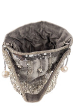 Silver potli bag with cutdana pearl and sequin embellishments on raw silk fabric with tassel for wedding and festive wear