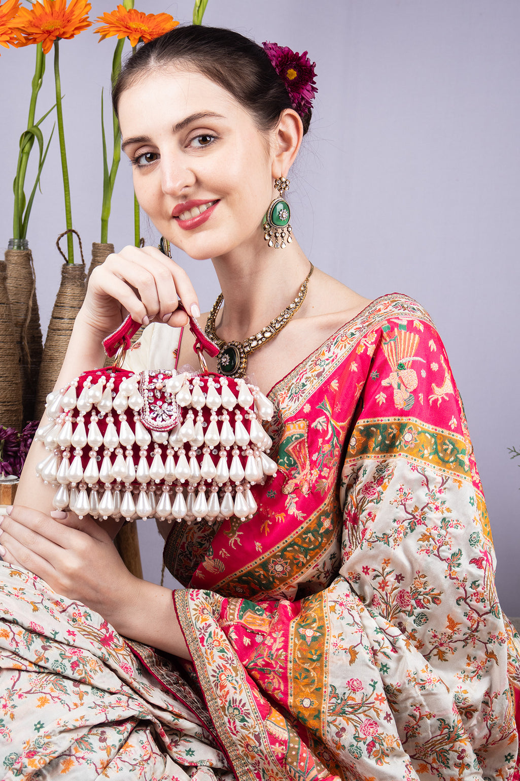 Pearl handcrafted clutch bag with traditional detailing short handle and detachable shoulder chain for wedding and festive wear