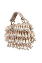 Handcrafted pearl clutch bag with traditional pearl detailing short handle and detachable shoulder chain for festive and wedding occasions