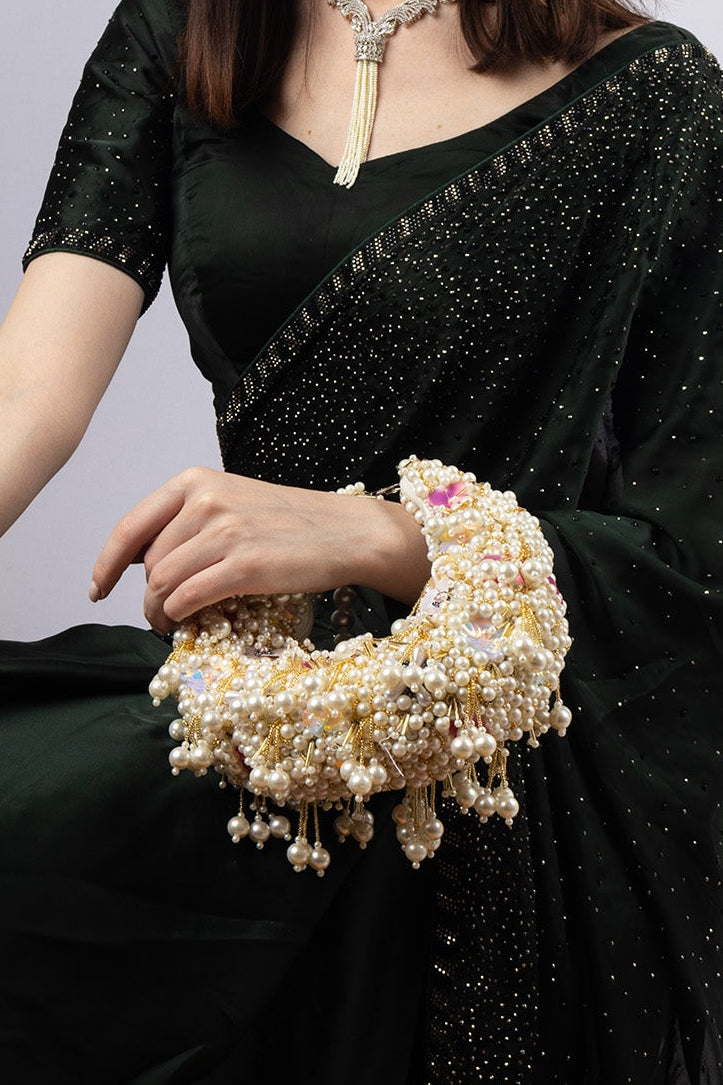 Ivory pearl cluster handle bag with floral embellishment handcrafted ethnic clutch for wedding and festive wear