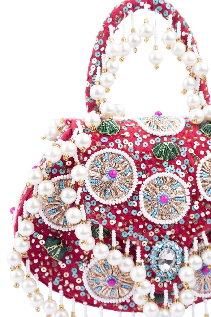 Red handcrafted potli bag with beads sequins zari embroidery and pearl detailing with chain strap for wedding and festive wear