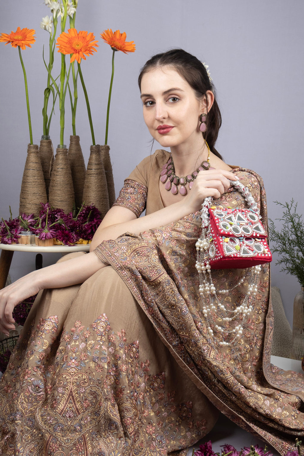 Red mirror work handcrafted clutch bag with stone beads and pearl embellishments for wedding and festive wear