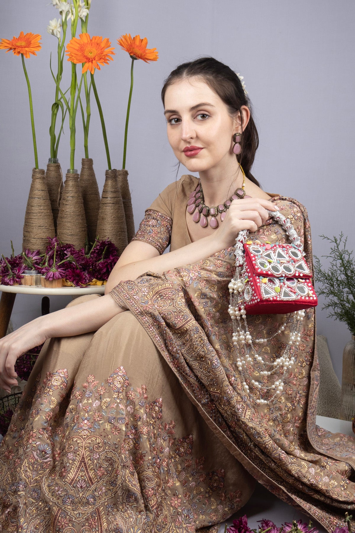 Red mirror work handcrafted clutch bag with stone beads and pearl embellishments for wedding and festive wear