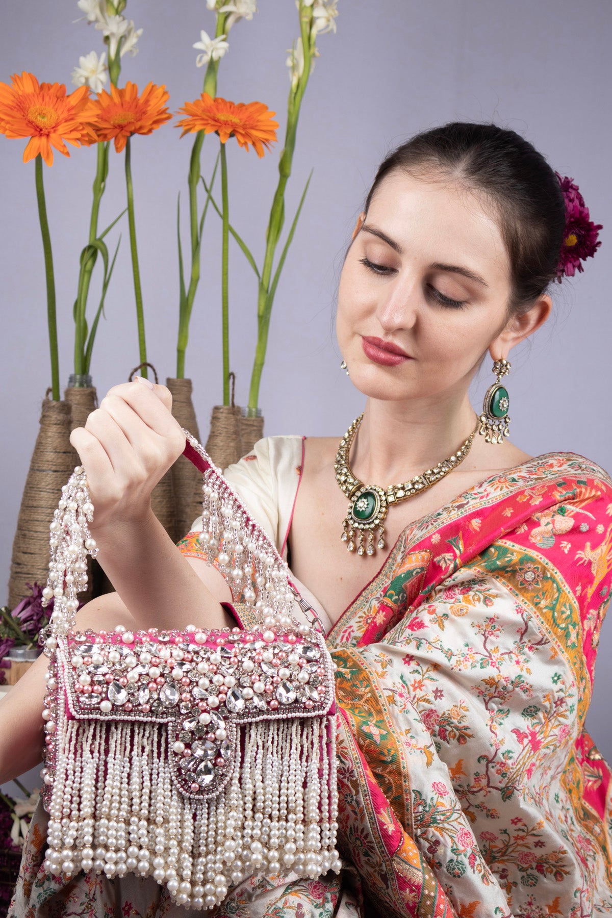 Pink stone work pearl and bead embellished evening handbag with fringe detailing for wedding and party wear