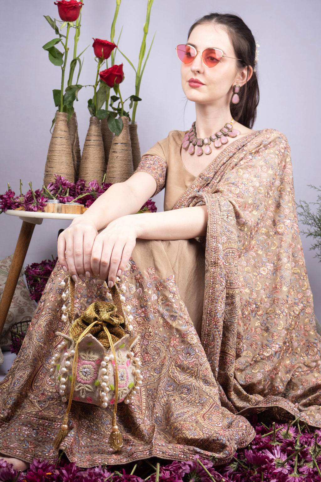 Beige gold lotus shape pearl zardosi suede potli bag with floral embroidery for wedding and bridal wear