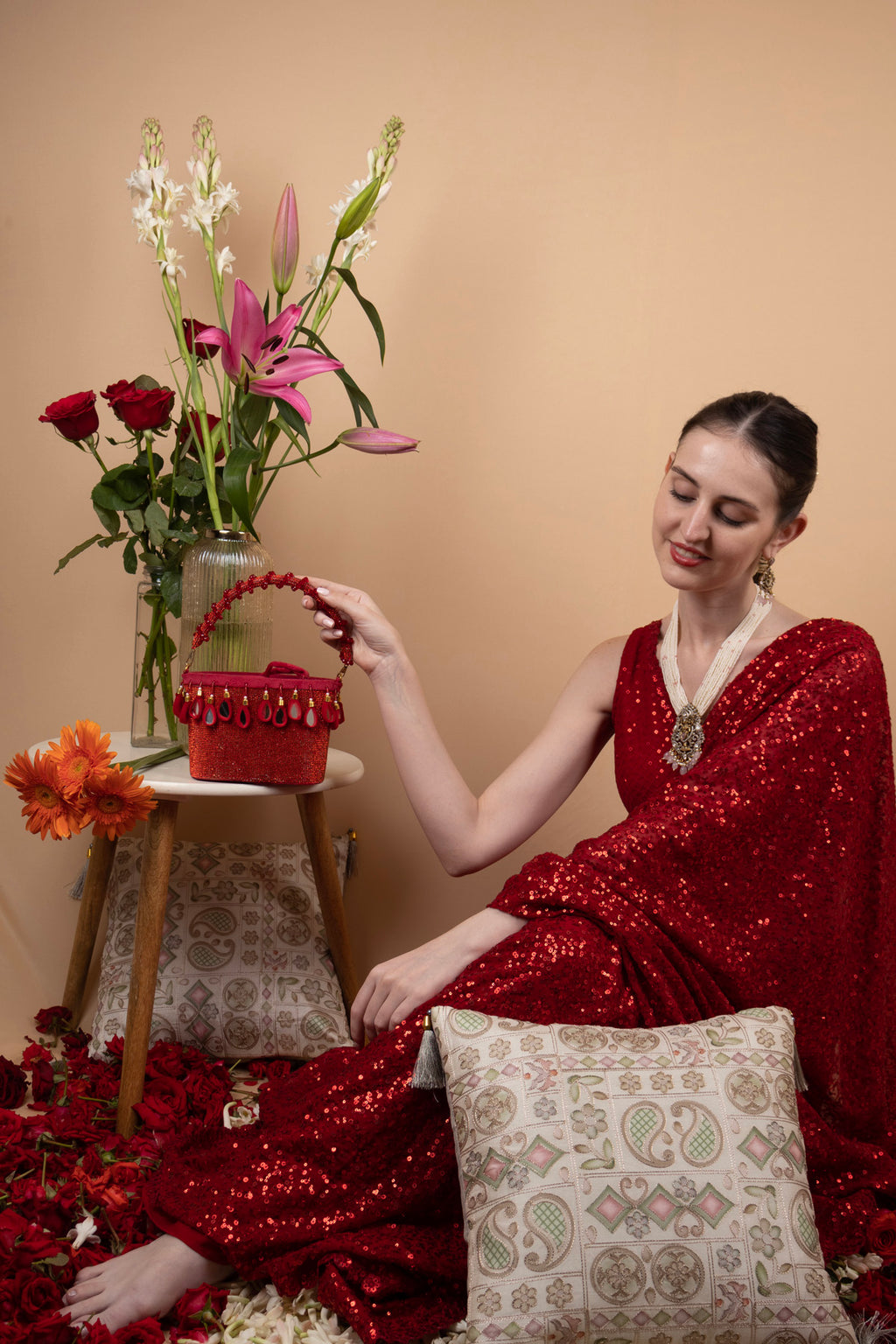 Red crystal potli bag with drawstring tassels for wedding and party wear