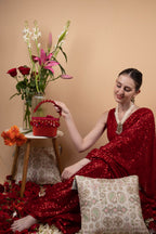 Red crystal potli bag with drawstring tassels for wedding and party wear