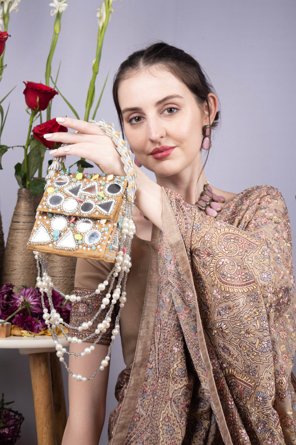 Gold clutch bag with mirror work, stone and pearl embellishments for wedding and festive occasions