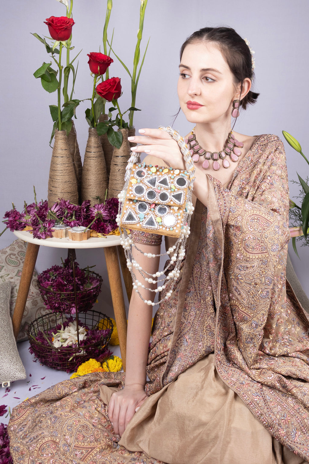 Gold clutch bag with mirror work, stone and pearl embellishments for wedding and festive occasions