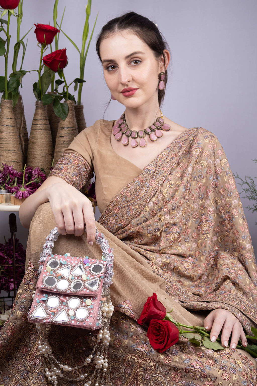 Pink handcrafted mirror work clutch bag with bead stone pearl embellishments structured handle suede lining festive wedding ethnic wear