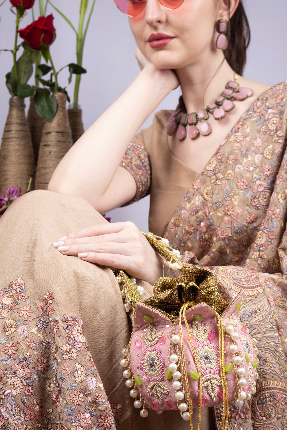 Blush pink lotus shape pearl zardosi suede potli bag for wedding and festive wear