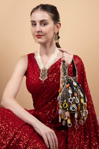 Black velvet potli bag with pearl mirror work cutdana bead embroidery and hanging embellishments festive wedding ethnic designer accessory