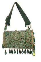 Black handcrafted potli bag with sequin cutdana beadwork stones and drawstring closure for festive and wedding wear