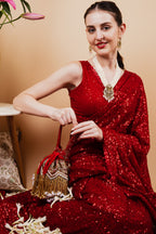 Red velvet potli bag with cutdana pearl and stone embellishments with drawstring and handle for wedding and festive wear
