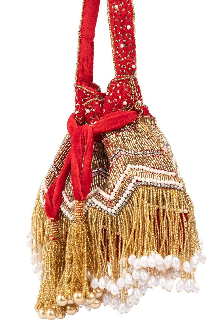 Red velvet potli bag with cutdana pearl and stone embellishments with drawstring and handle for wedding and festive wear