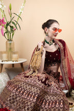 Suede potli bag with cutdana and crystal work cascading embellishments drawstring closure and handle for wedding and festive wear