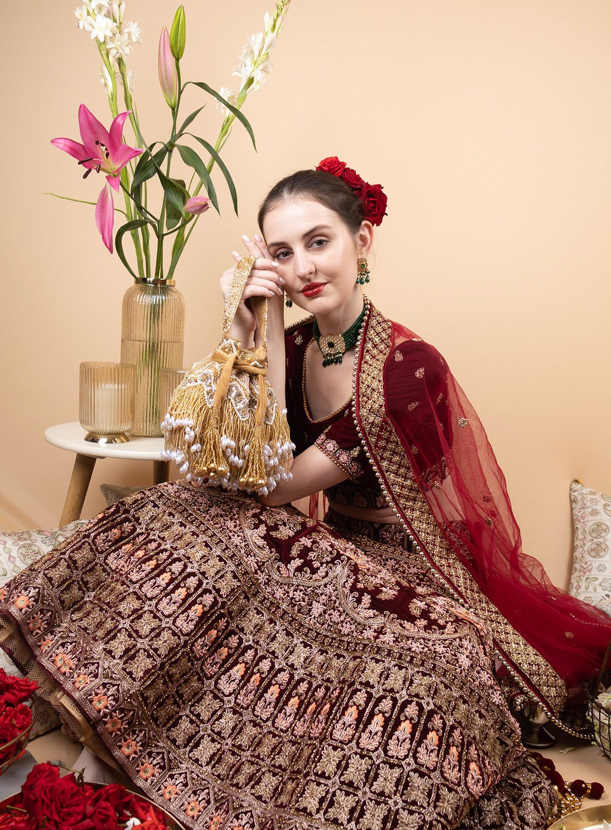 Gold velvet potli bag with cutdana pearl and stone embellishments with drawstring and handle for wedding and festive wear