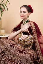 Gold beaded mirror work handle bag with pink accents and mirror embellishments for wedding and festive wear