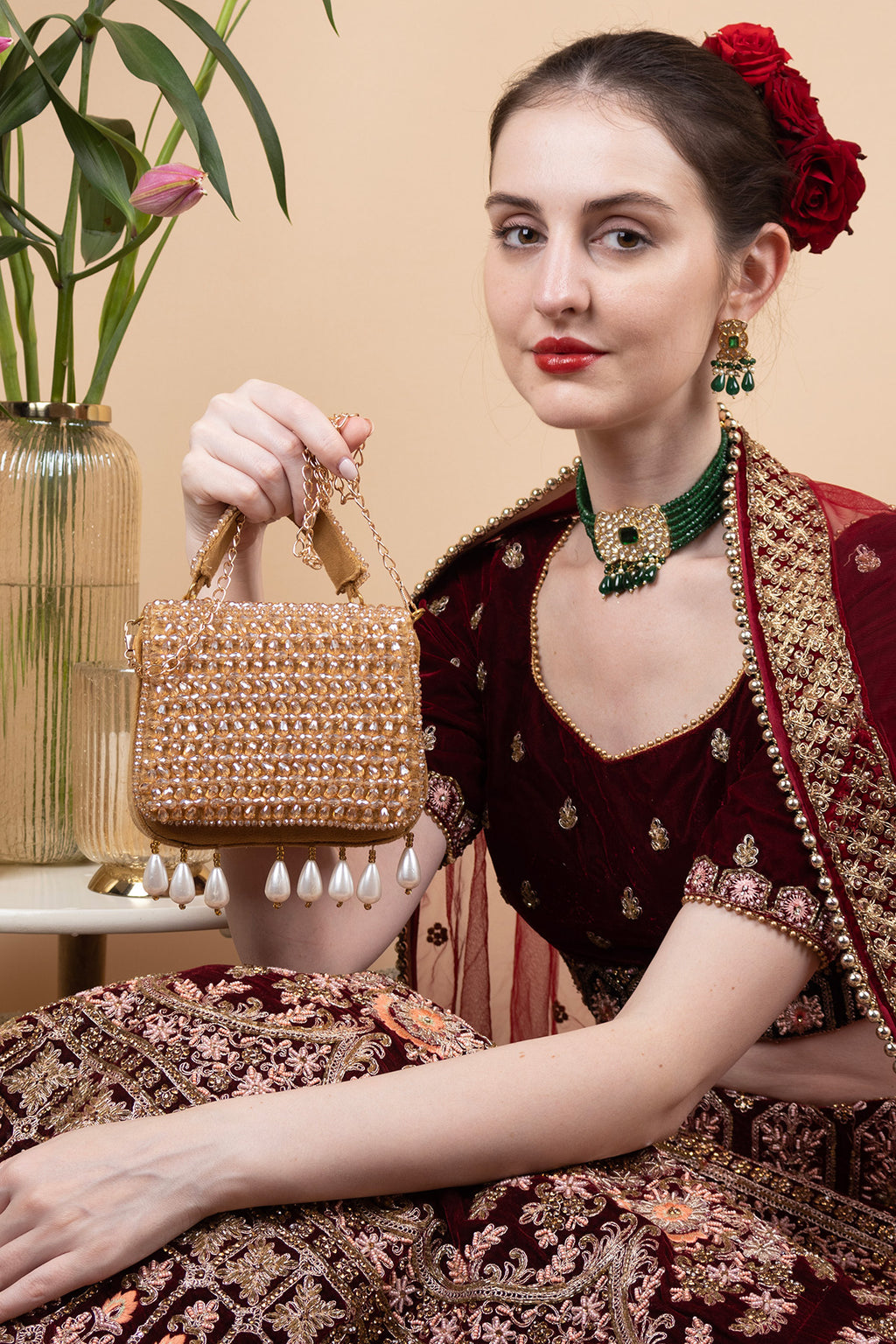 Gold crystal embellished evening handbag with structured design handle and chain strap for wedding and party wear