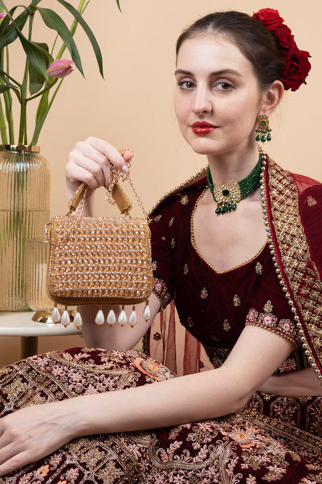Gold crystal embellished evening handbag with structured design handle and chain strap for wedding and party wear Hover Image