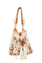 Velvet potli bag with cascading pearl strands, drawstring closure and embellished handle for wedding and festive occasions
