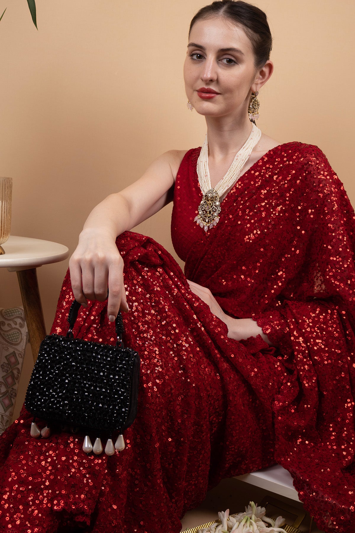 Black crystal embellished evening handbag with structured design handle and chain strap for wedding and party wear