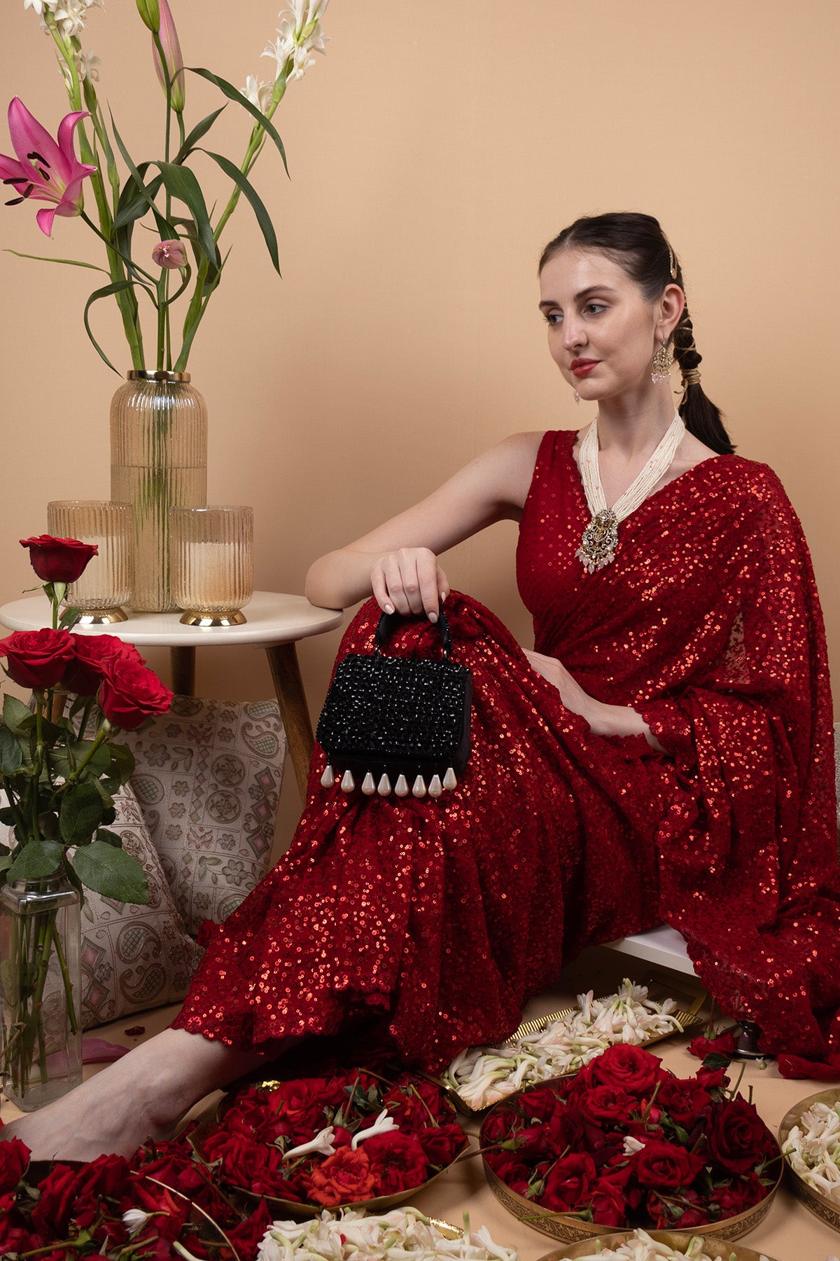 Black crystal embellished evening handbag with structured design handle and chain strap for wedding and party wear
