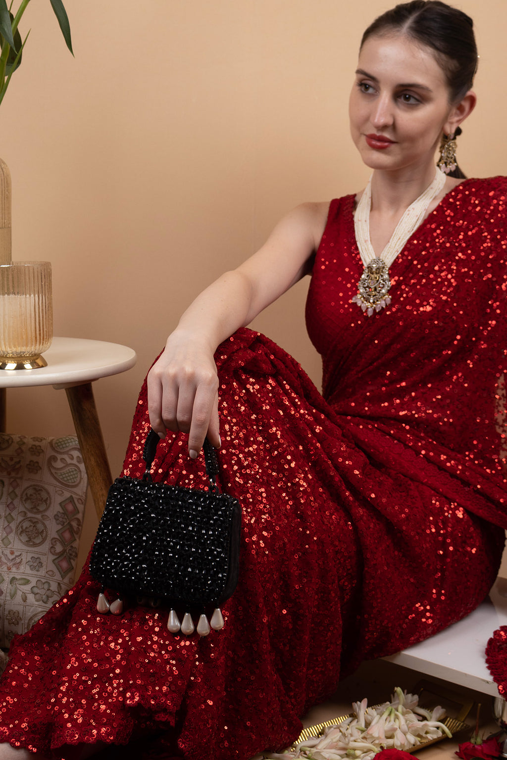 Black crystal embellished evening handbag with structured design handle and chain strap for wedding and party wear