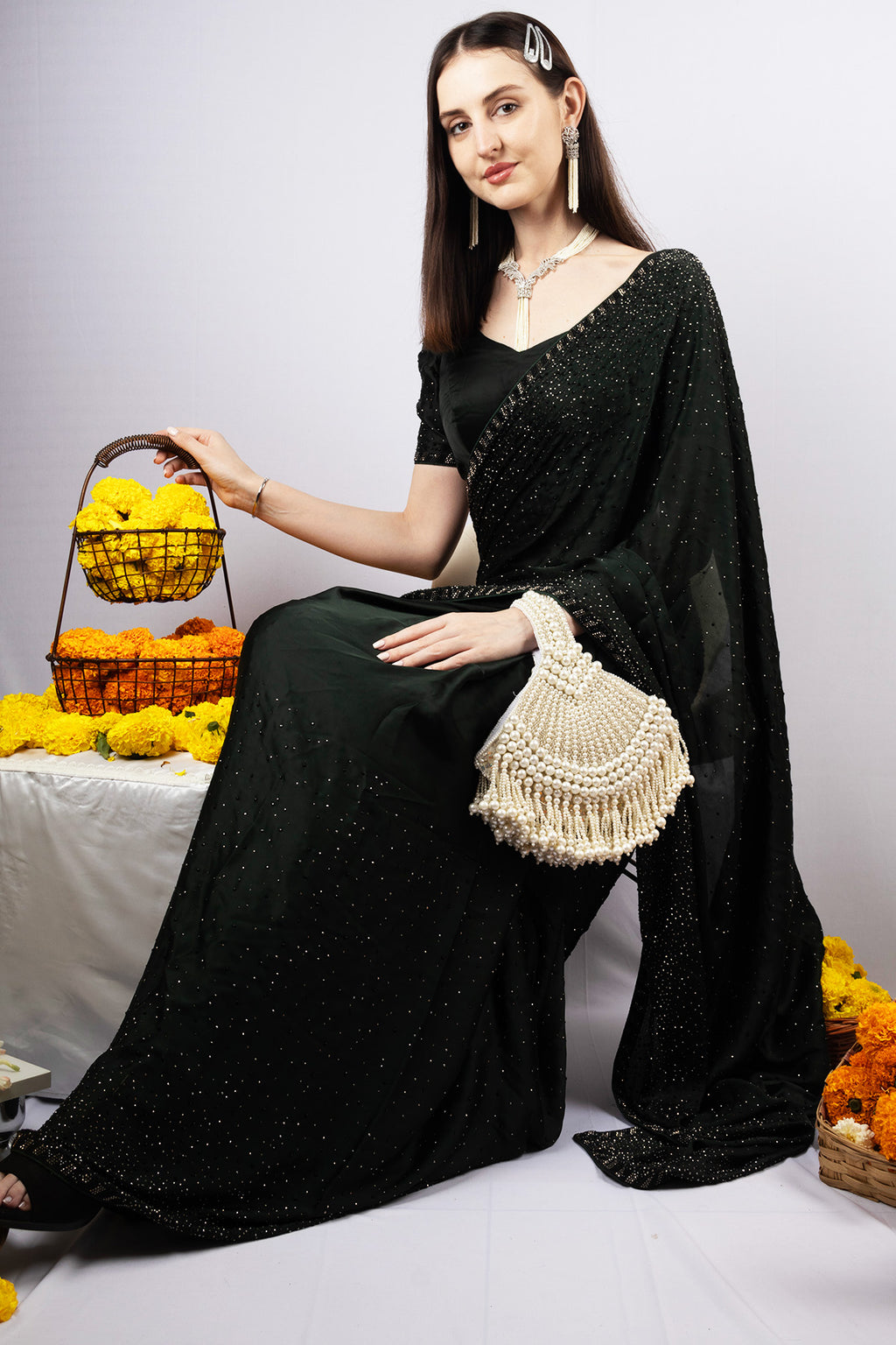 Ivory pearl beaded clutch bag with fringe detailing and velvet lining for wedding and festive wear