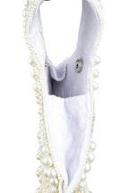 Ivory pearl beaded clutch bag with fringe detailing and velvet lining for wedding and festive wear