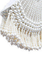 Ivory pearl beaded clutch bag with fringe detailing and velvet lining for wedding and festive wear