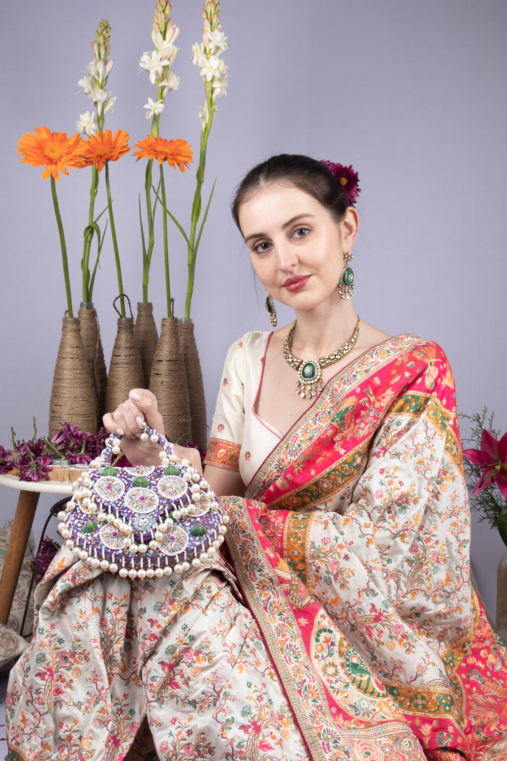 Purple handcrafted potli bag with beads sequins zari embroidery and pearl detailing with chain strap for wedding and festive wear