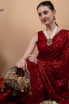 Green beaded floral mirror work clutch bag with handcrafted detailing and suede lining for wedding and festive wear