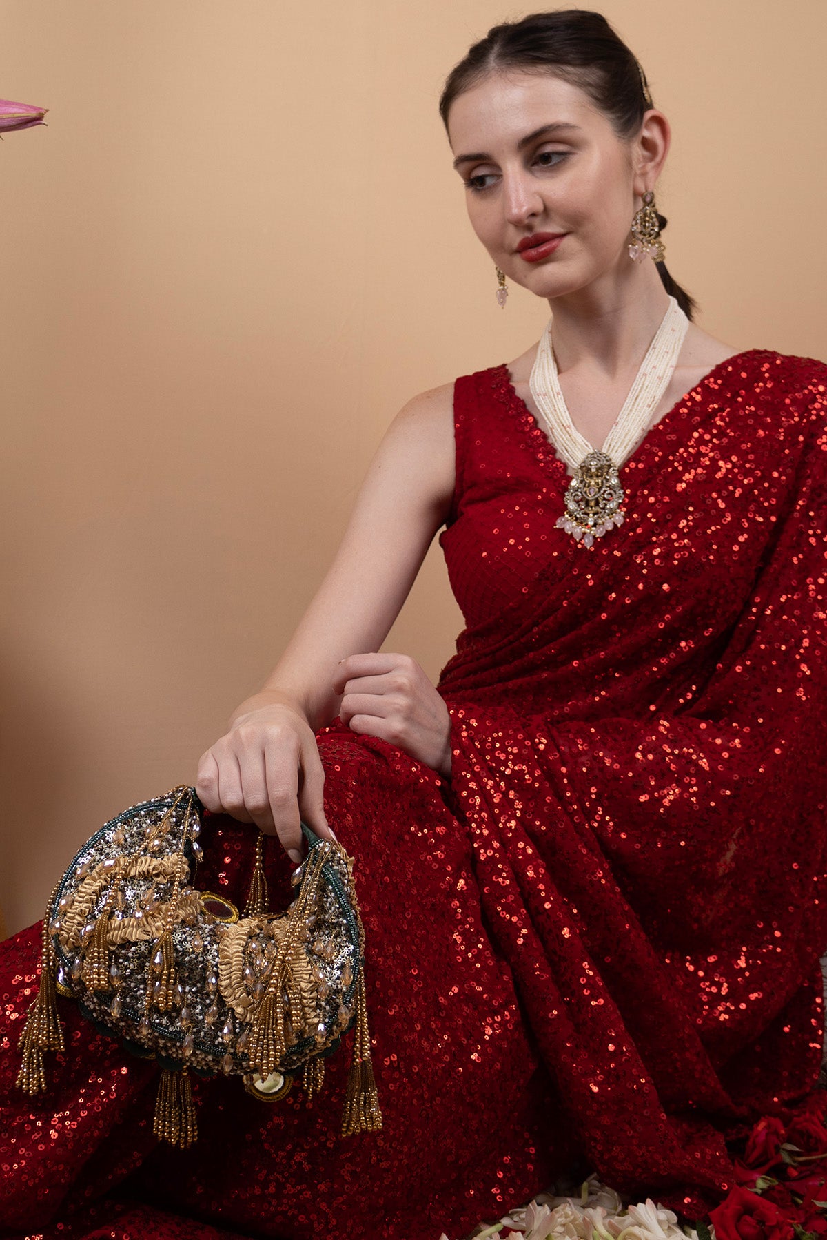 Green beaded floral mirror work clutch bag with handcrafted detailing and suede lining for wedding and festive wear