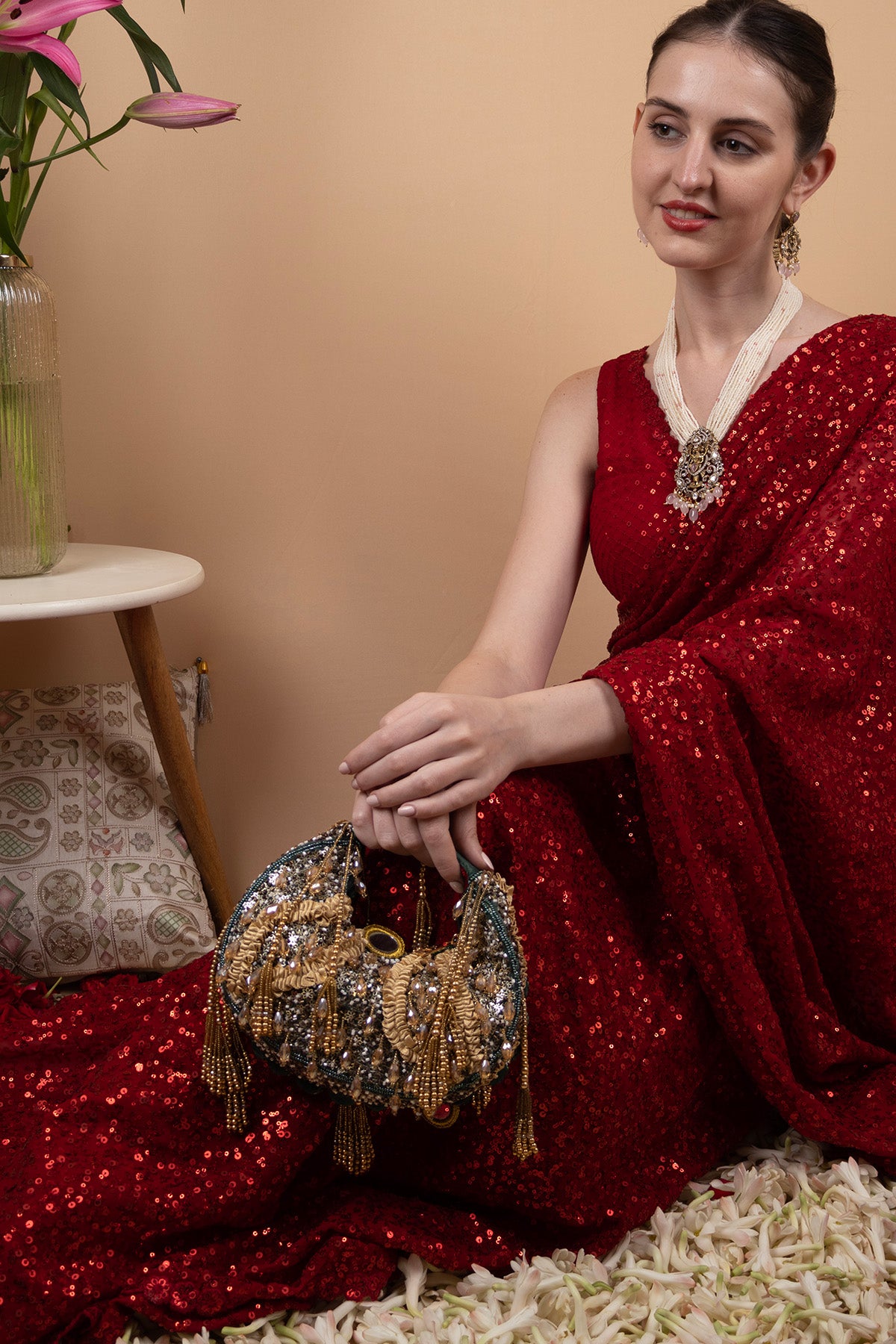 Green beaded floral mirror work clutch bag with handcrafted detailing and suede lining for wedding and festive wear