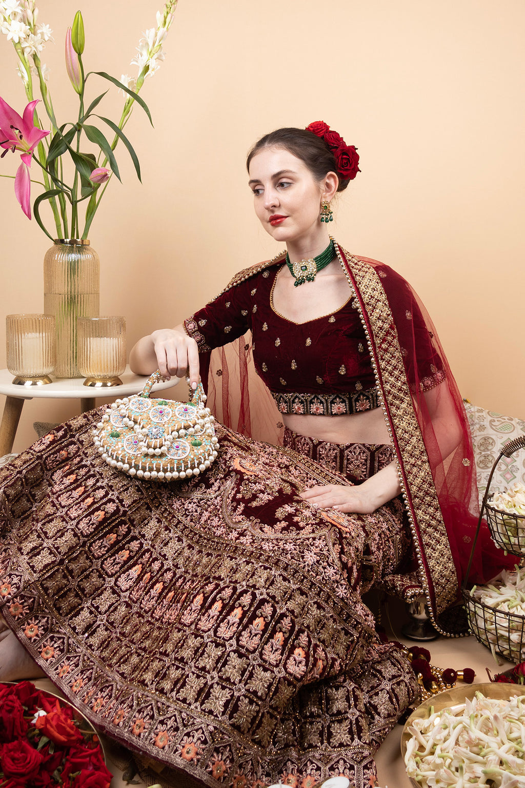 Beige handcrafted potli bag with beads sequins zari embroidery and pearl detailing with chain strap for wedding and festive wear