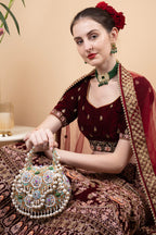 Beige handcrafted potli bag with beads sequins zari embroidery and pearl detailing with chain strap for wedding and festive wear

