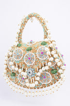 Beige handcrafted potli bag with beads sequins zari embroidery and pearl detailing with chain strap for wedding and festive wear