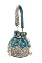 Blue raw silk potli bag with sequins cutdana and pearl embellishments with tassel for wedding and festive wear