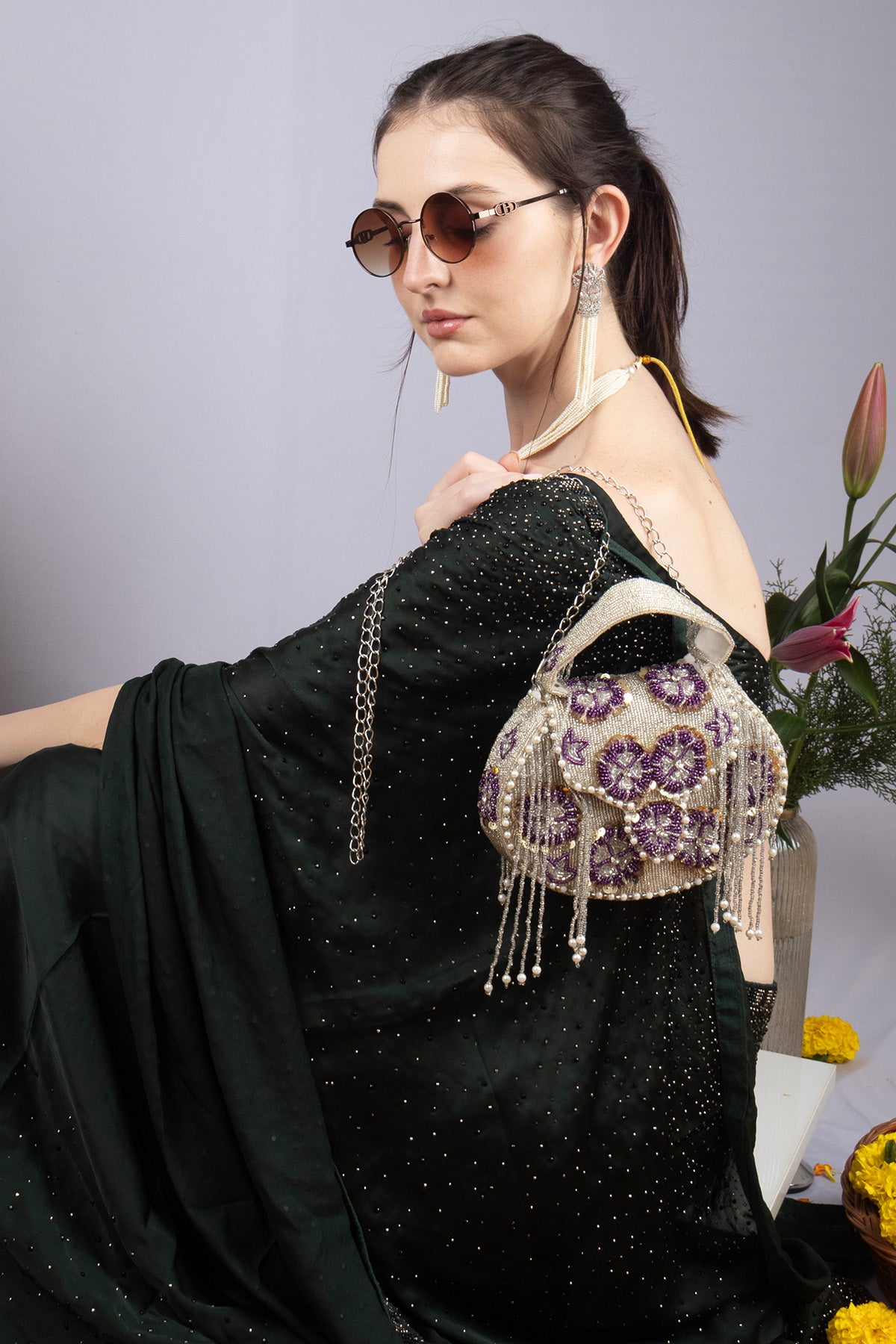 Silver hand-embellished clutch bag with cutdana pearl crystal and sequin work with chain strap for wedding and festive wear