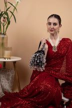 Black velvet potli bag with crystal dangling stones and bead embellishments for wedding and festive wear