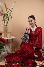 Black velvet potli bag with crystal dangling stones and bead embellishments for wedding and festive wear